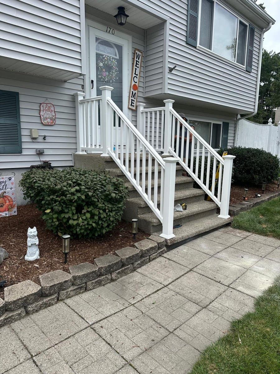 Farmers porch with white vinyl railing on a South Shore, MA home