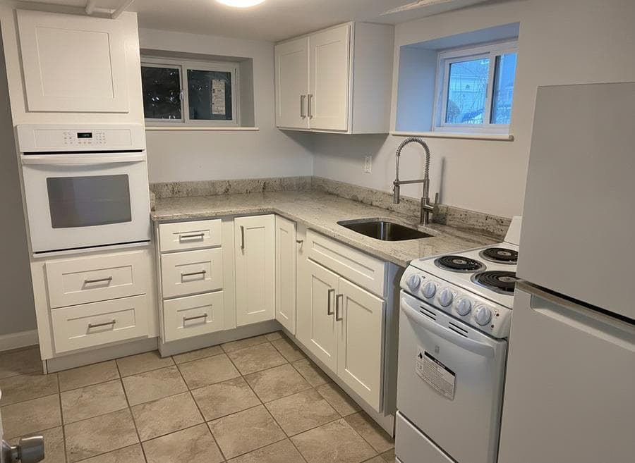 Remodeled kitchen with new cabinets and island in a South Shore, MA home